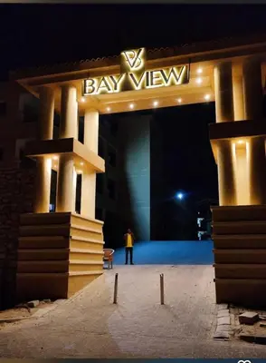 a person standing in front of a building at night at Sahl Hasheesh in Hurghada