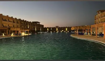 a view of a canal in a city at night at Sahl Hasheesh in Hurghada