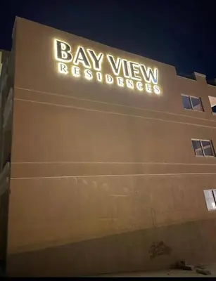 a building with a sign that reads bay view residence at Sahl Hasheesh in Hurghada