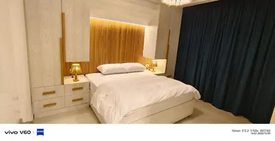 a bedroom with a white bed and a window at Moon Hills Palace in Hurghada