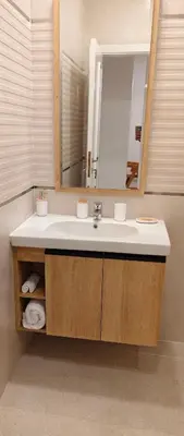 a bathroom with a sink and a mirror at Moon Hills Palace in Hurghada