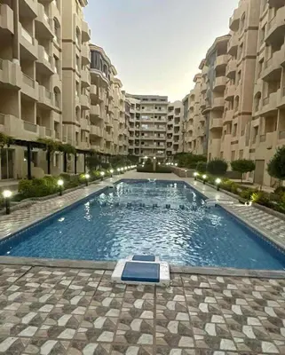 a large swimming pool in the middle of a building at Hurghada ,Mo&Kate Florenza Khamsin in Hurghada