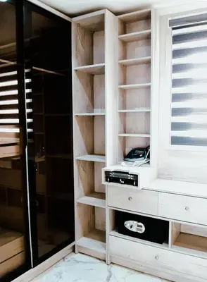 a closet with wooden shelves and a window at VIP villa heated pool & Spa & fully entertained in Hurghada