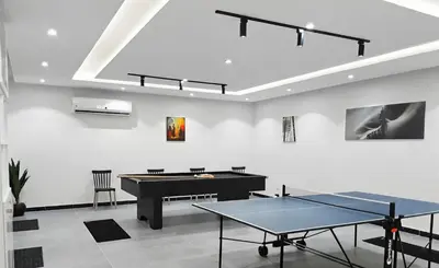 a ping pong room with a ping pong table at VIP villa heated pool & Spa & fully entertained in Hurghada