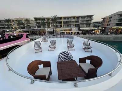 a group of chairs and tables on top of a boat at The yacht in Hurghada