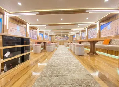 a room with a row ofools and tables in a building at The yacht in Hurghada