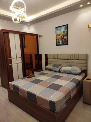 a bedroom with a large bed with a checkered mattress at Princese Resort Beach 1ST Avenue SouthSide in Hurghada