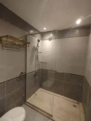 a bathroom with a shower with a toilet and a sink at Princese Resort Beach 1ST Avenue SouthSide in Hurghada