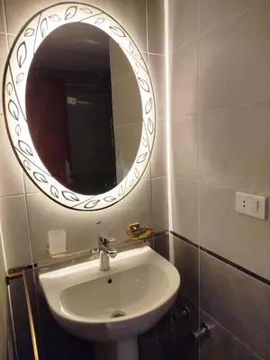 a bathroom with a sink and a mirror on the wall at Princese Resort Beach 1ST Avenue SouthSide in Hurghada