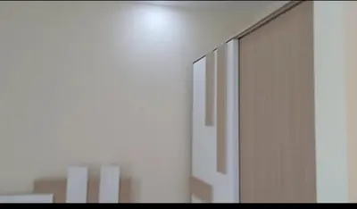a room with white walls and a sliding glass door at Mirage aquapark resort 776c in Hurghada