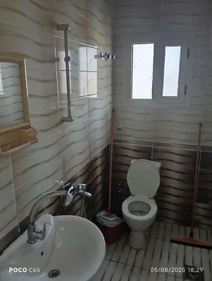 a bathroom with a toilet and a sink at oasis resort ,areada HRG in El Gouna