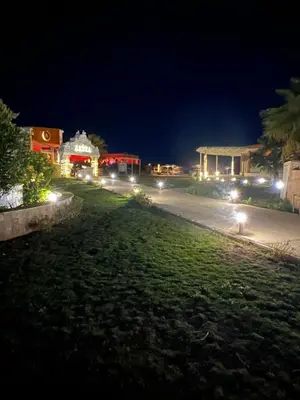 a city street at night with lights on the street at Selena bay hurghada in Hurghada