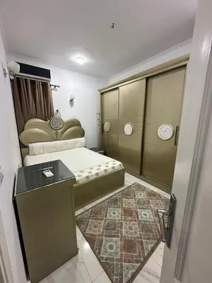 a small room with a bed and a table at Red Sea view in Hurghada