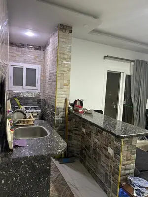 a kitchen with a sink and a counter top at Red Sea view in Hurghada