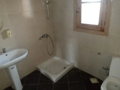 a bathroom with a shower and a sink and a toilet at Shifaya House in Aswan