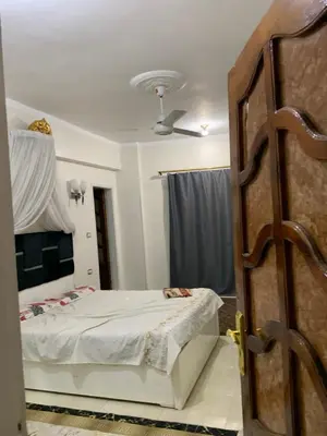 a bedroom with a bed and a ceiling at Luxor is adorable! in Luxor