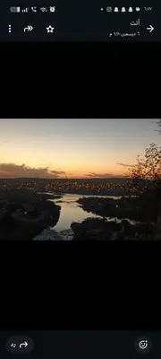 a view of a river at sunset at noreno houseاسوان شياخة تانية طريق السادات in Aswan