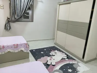 a room with a rug with a unicorn on it at noreno houseاسوان شياخة تانية طريق السادات in Aswan