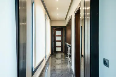 a corridor in a building with a hallway at Private Ali Pasha 2BR Pool Access + Dining Perks in Hurghada