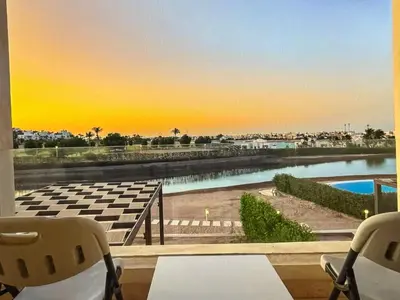 a view of a pool from a room with a window at View and Location in Abu Tig Marina in Hurghada