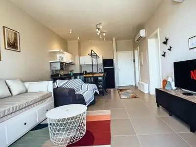 a living room with a couch and a table at View and Location in Abu Tig Marina in Hurghada