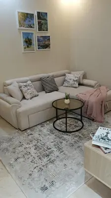 a living room with a couch and a table at Mirage bay aquapark 772B in Hurghada