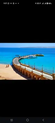 a picture of a pier in the ocean with the water at Sahl hashish in Hurghada