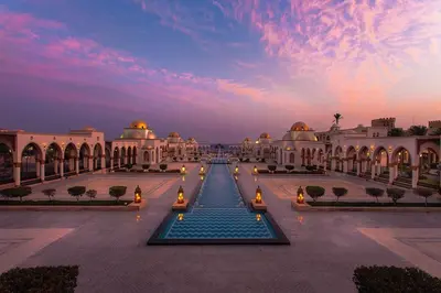 a building with a fountain in the middle of a courtyard at Sahl hashish in Hurghada
