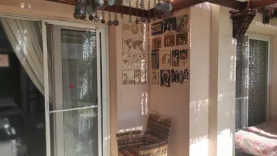 a corner of a room with a window and a mirror at Apartment with garden in sahl hasheesh in Hurghada