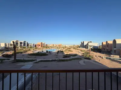 a view of a beach from a balcony of a resort at Fresh & Modern 2BR • Newly Furnished Kamaran in Hurghada