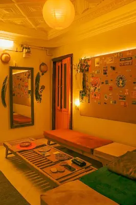 a living room with a couch and a table at Jme Bunks Hostel in Aswān
