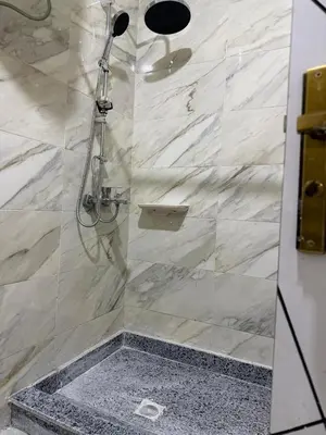 a shower with a glass door in a bathroom at Tiba Golden Beach Hurghada in Hurghada