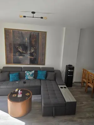 a living room with a couch and a table at 2 Bedroom Duplex - Hurghada in Hurghada