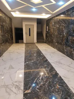an empty lobby with a marble floor and stairs at Solitaire in Hurghada