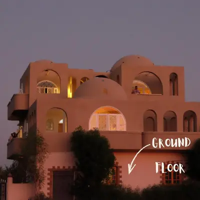 a building with a sign that reads ground floor hope at Mountian View Domes in Al Aqālitah