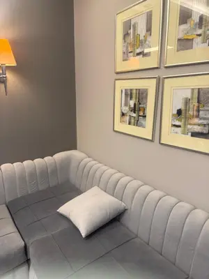 a white couch with a pillow on top of it at Veranda resort in Hurghada