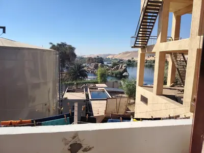 a view of a house under construction with a boat at venti house1 in Nag` el-Ramla