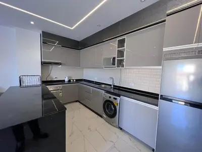 a kitchen with a washer and a washing machine at Luxury Panorama Sea View Residence with sky pool in Hurghada
