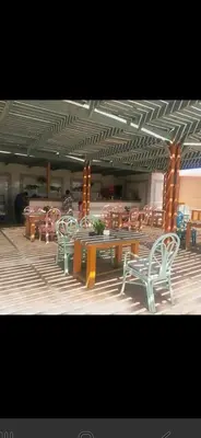 a group of tables and chairs in a building at Hurghada Pool & See View Studio in Hurghada
