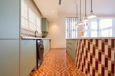 a kitchen with an orange tile floor and a counter at The Reef House Luxury Waterfront Villa in Hurghada