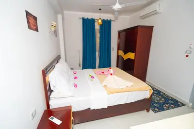 a bedroom with a bed in a room at Queen of Merit in Luxor