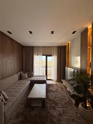 a living room with a couch and a table at Luxury Sea View Apartment Near Hurghada Airport in Hurghada