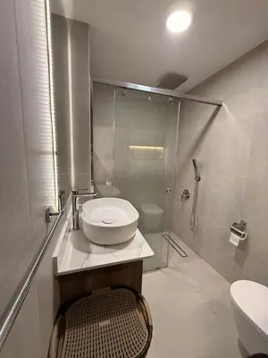 a bathroom with a shower and a toilet and a sink at Luxury Sea View Apartment Near Hurghada Airport in Hurghada