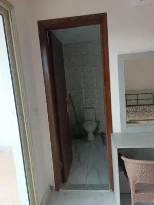 a bathroom with a toilet in a room at ميراج باى in Hurghada