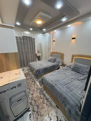 a room with two beds in a room at fayrouz in Al Aqālitah