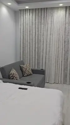 a living room with a bed and a couch at Hambra avenue resort in Hurghada