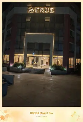a large building with a sign on the front of it at Hambra avenue resort in Hurghada