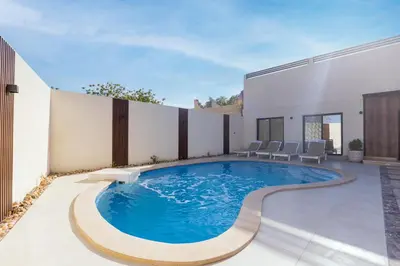 a swimming pool in the backyard of a house at Private Villa AL Mamsha Private Pool in Hurghada