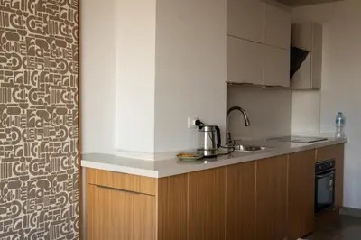 a kitchen with a sink and a counter top at New Modern Boutique 2BR - Sunset & Sea views in Hurghada