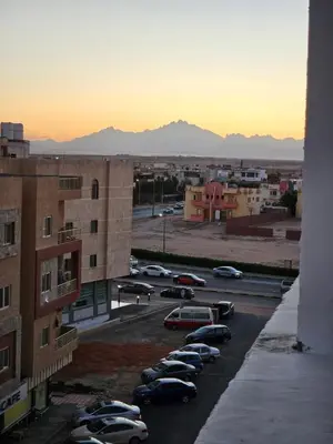 a group of cars parked in a parking lot at Sky View in Hurghada